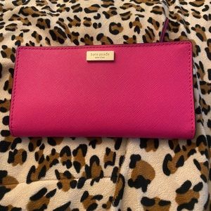 Pink Kate Spade wallet 
Leather material